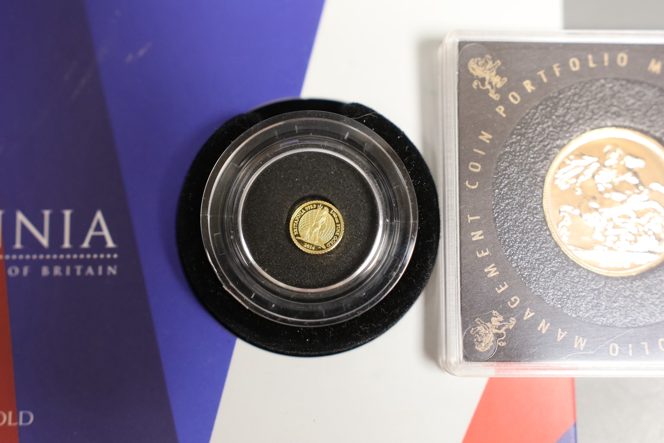 A UK 2016 gold sovereign, in a capsule and a Royal Mint 2014 Britannia 40th ounce gold proof coin (2)